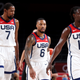 Kevin Durant, Damian Lillard and Jrue Holiday of Team United States look on against Team Australia during the second half of a Men’s Basketball quarterfinals game on day thirteen of the Tokyo 2020 Olympic Games at Saitama Super Arena on August 05, 2021 in Saitama, Japan.